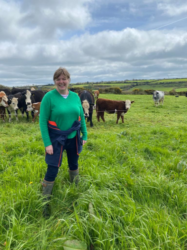 Cherilyn in a field with cows